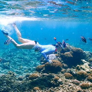 Woman with mask snorkeling